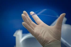 thin glass wafer held in hand